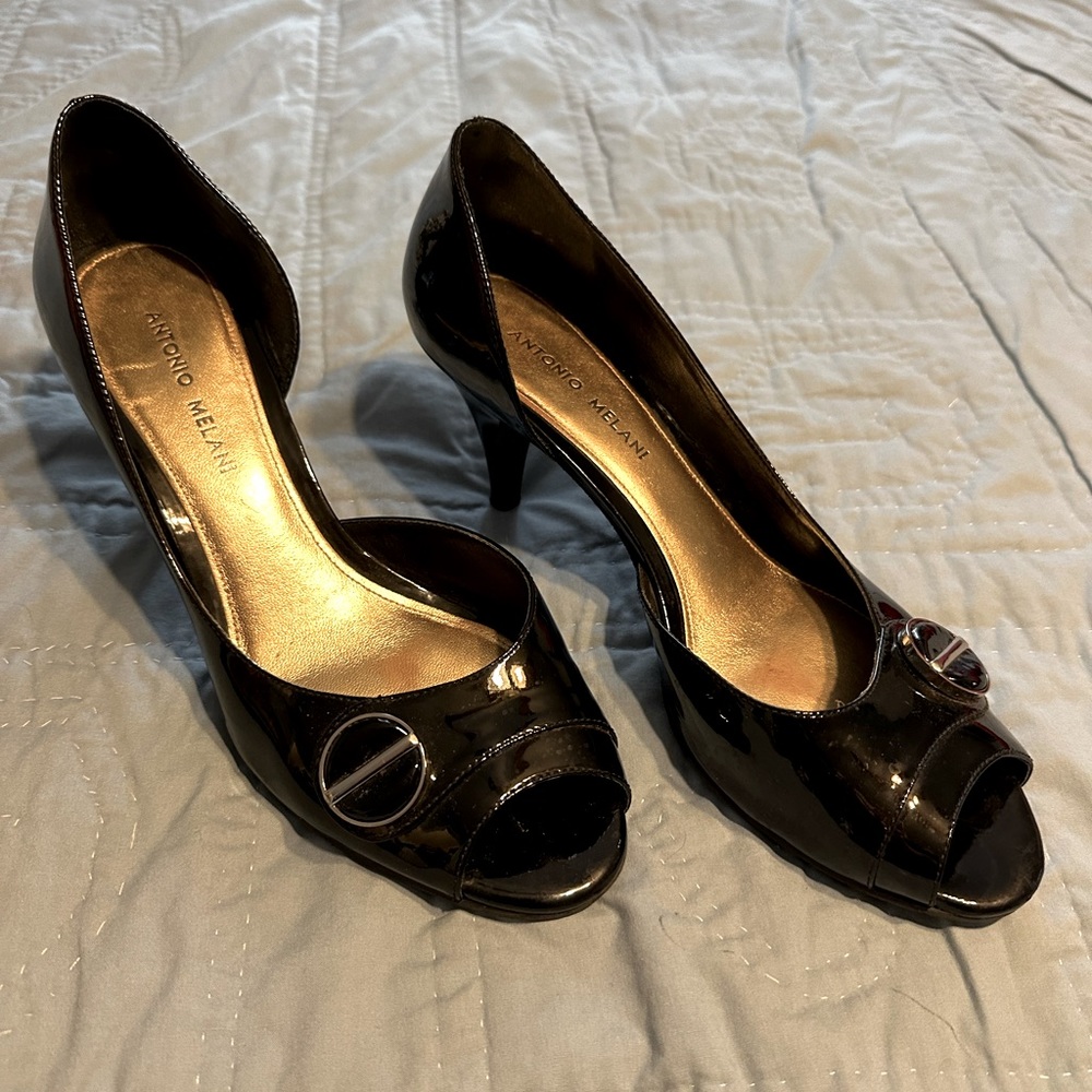 Black patent peekaboo pumps